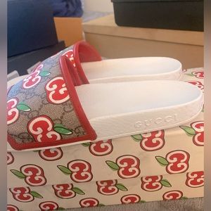White and red Gucci slides